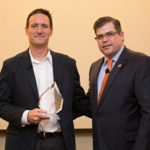 Dr. Baranzini (left) accepting the Reingold Award from the Society’s Chief Advocacy, Services and Research Officer, Dr. Timothy Coetzee